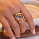 Arco Azzurro Ring Set worn on hand with blue stone detail