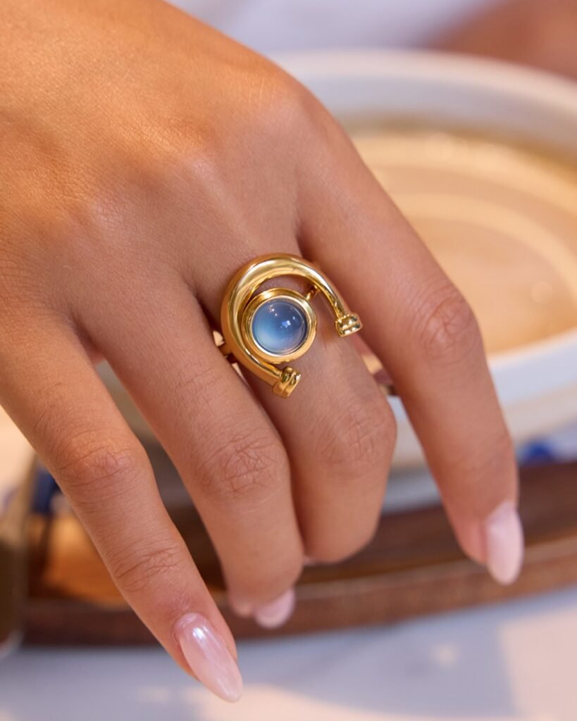 Arco Azzurro Ring Set worn on hand with blue stone detail