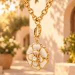 Close-up detail of Avelora Necklace showing polished golden rings and engraved silver-toned rings