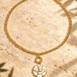 Avelora Necklace by Calvéra displayed on a clean studio background, showing its dual-tone ring design