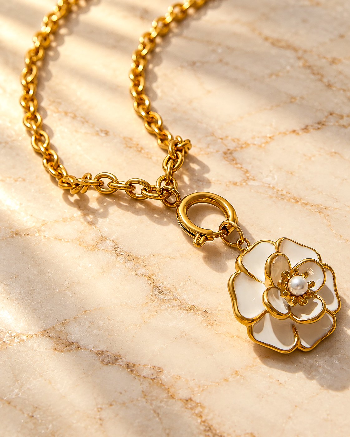 Close-up detail of Avelora Necklace showing polished golden rings and engraved silver-toned rings