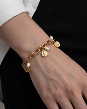 Charme Antico Bracelet close-up worn with pearl and coin charms