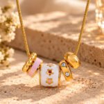 Cinque Cerchi Necklace full product view with five circular gold charms