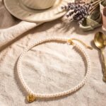 Cuore di Perla Necklace detail showing pearl-inspired beads and polished heart pendant