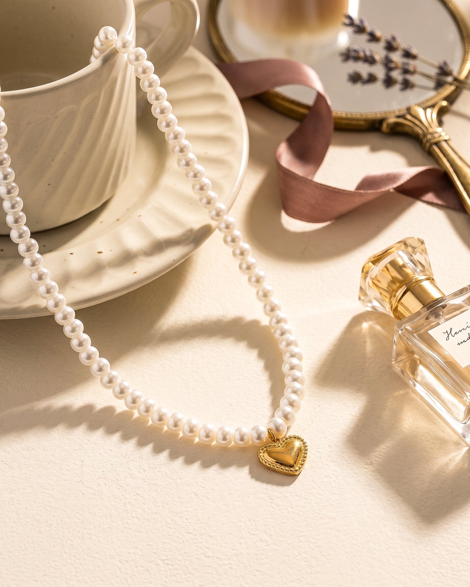 Cuore di Perla Necklace styled product image with pearl-inspired beads and heart pendant