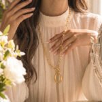 Valdora Necklace unfolded on model in a full outfit view