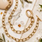 Valdora Necklace wrapped twice on a marble background