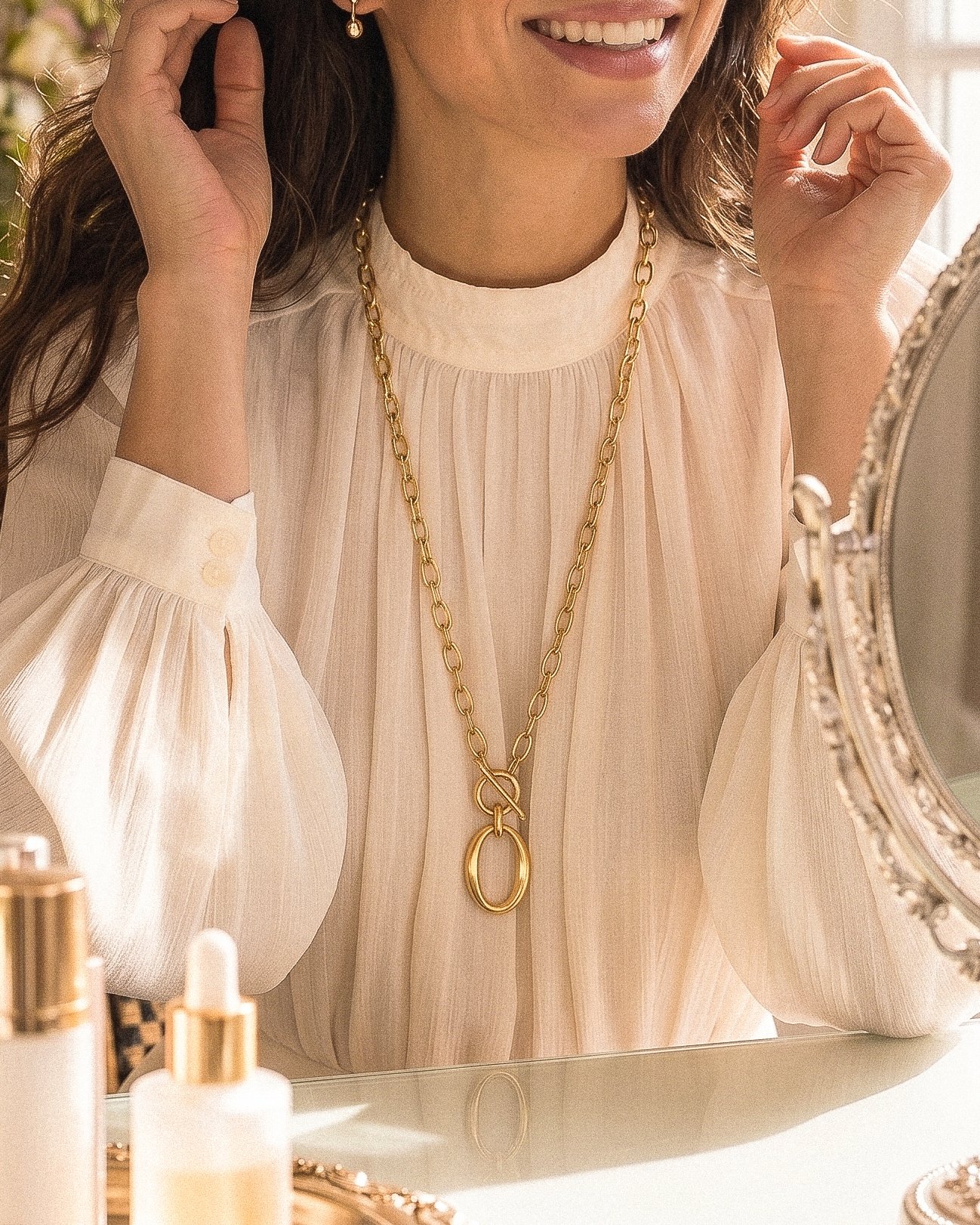 Valdora Necklace worn long on model with a refined side-angle view