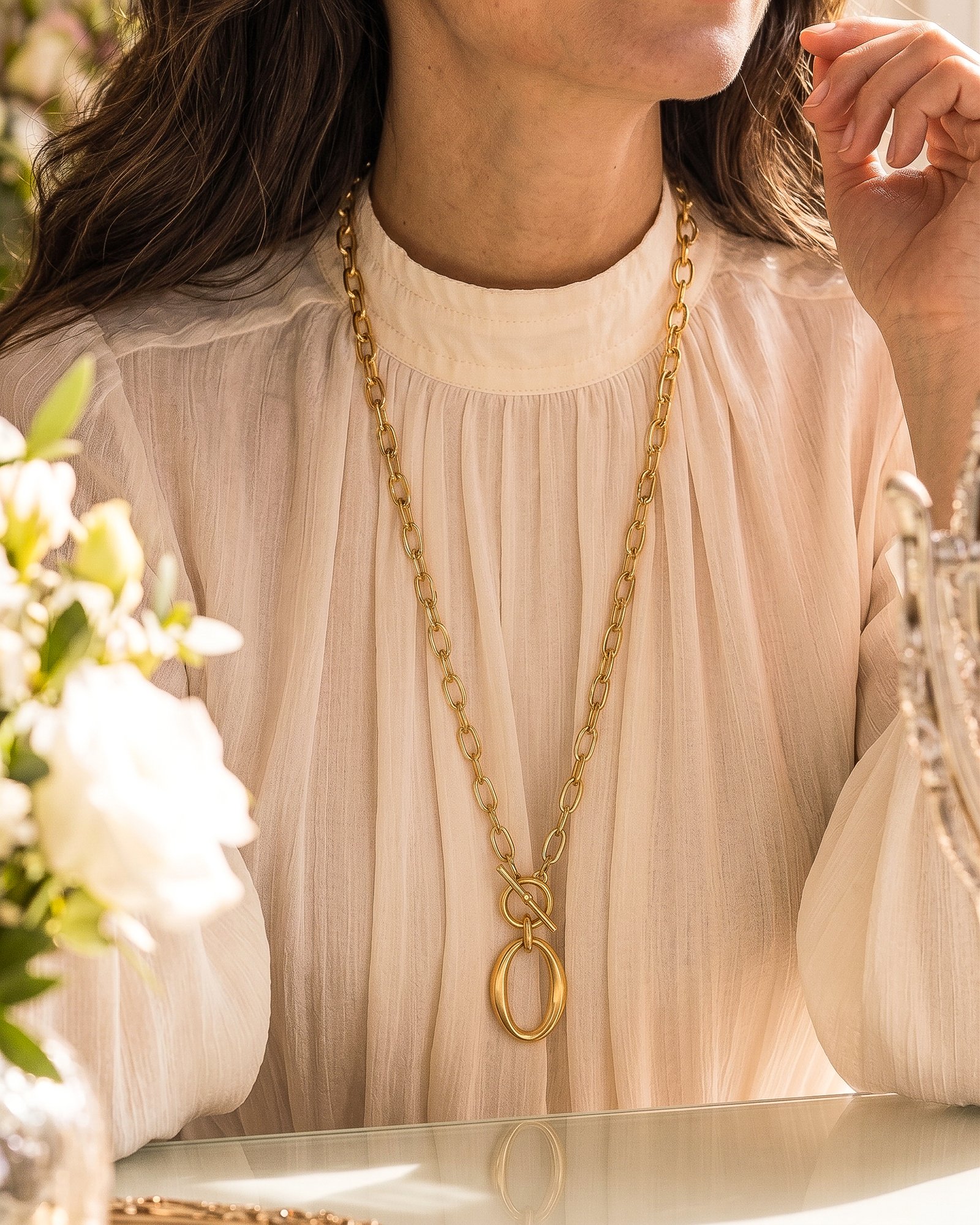 Valdora Necklace worn long on model with a sleek single-chain statement look