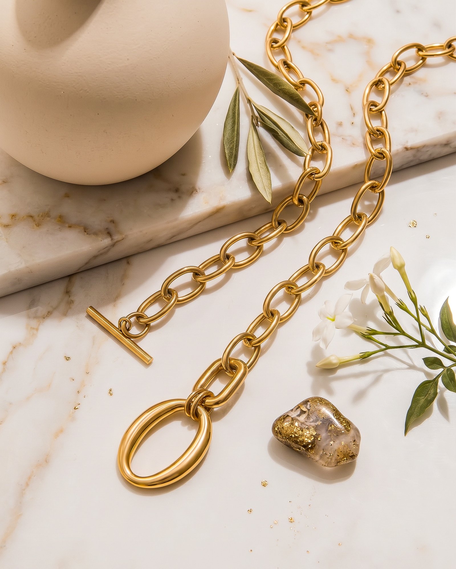 Valdora Necklace clasp and link detail on a marble background