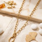 Valdora Necklace laid long on a marble background