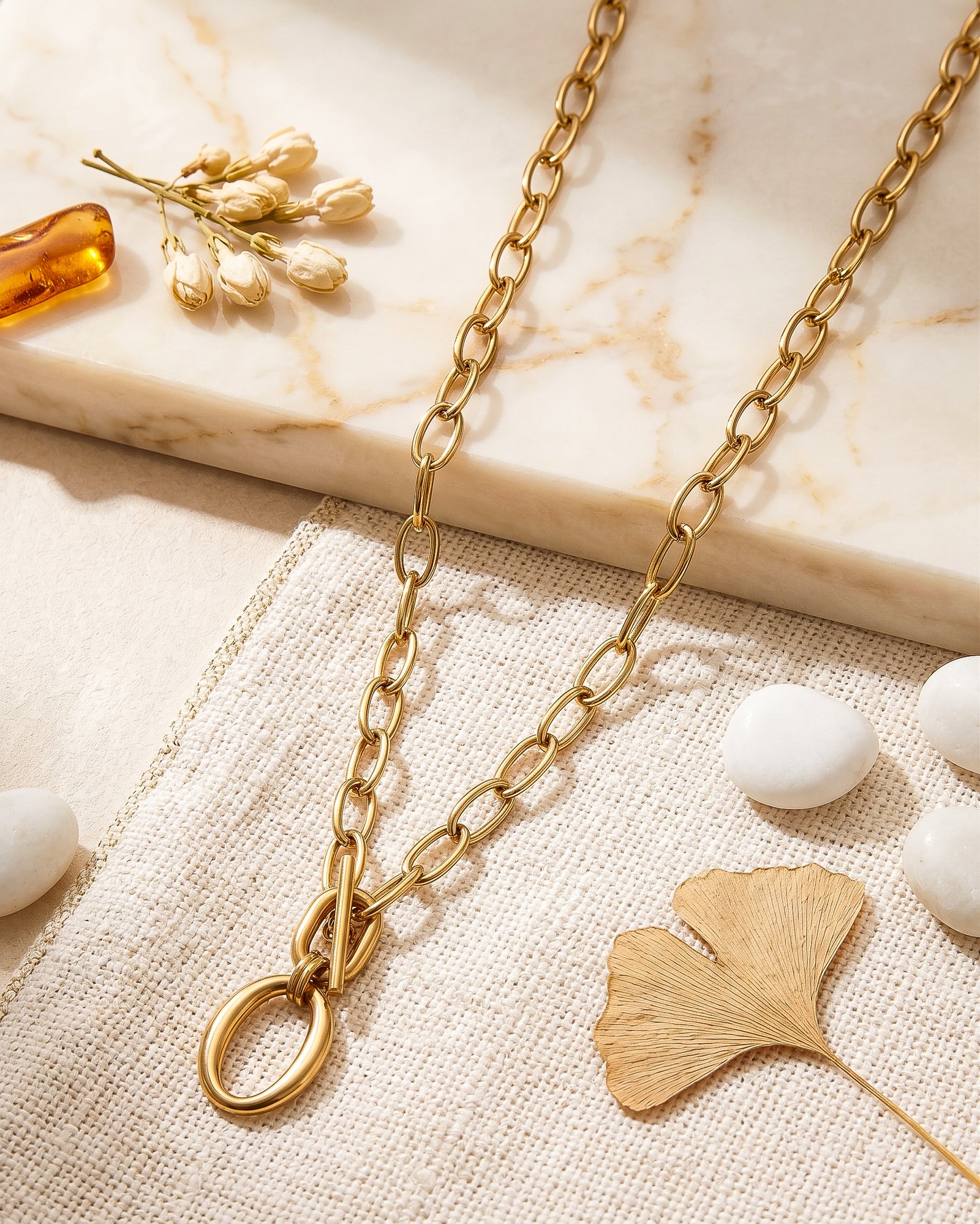 Valdora Necklace laid long on a marble background