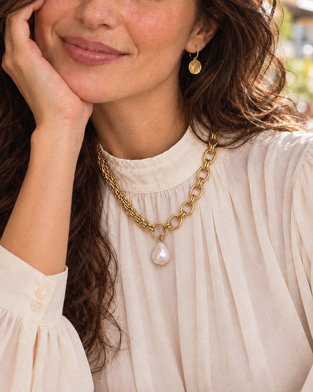 Valeria Necklace worn by model with mixed chain design and pearl-inspired pendant