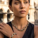 Portrait of model wearing Regia Trama Collection necklace and bracelet