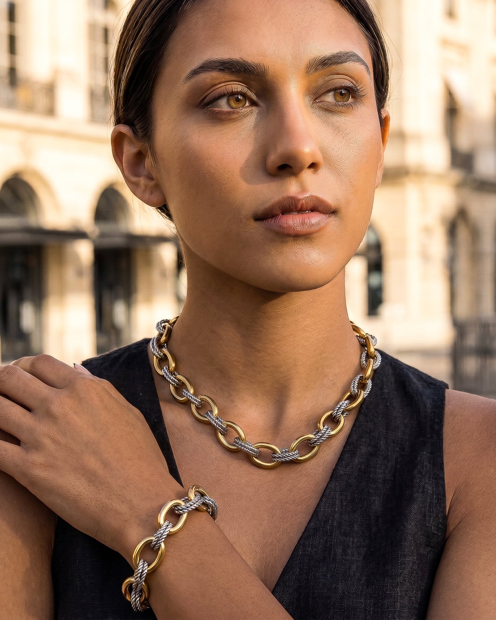 Portrait of model wearing Regia Trama Collection necklace and bracelet