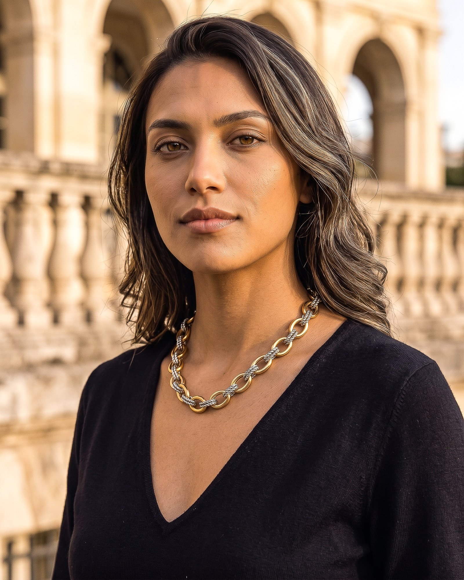 Close-up of Regia Trama Necklace on model with polished gold and engraved silver-toned details