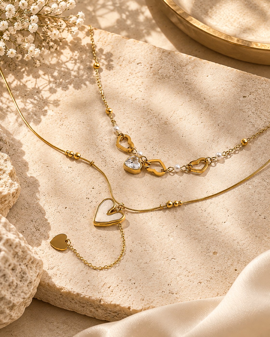 Cuore Doppio Necklace flat lay with double-layer gold chain and heart details