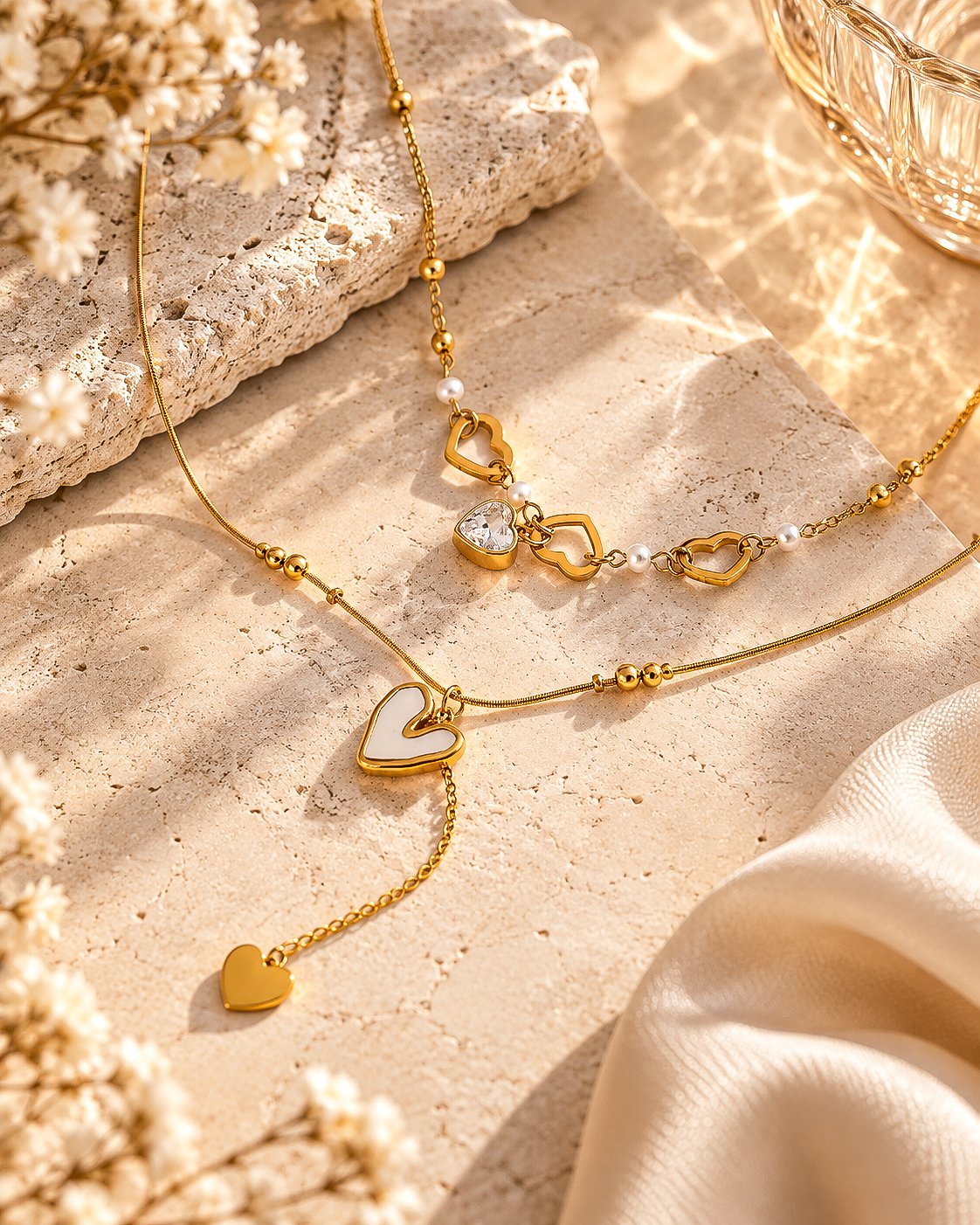 Cuore Doppio Necklace detail showing heart charms and pearl-inspired accents