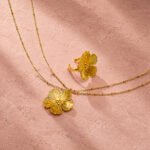 Fiore Aurelia Necklace product image with floral pendant and double chain design