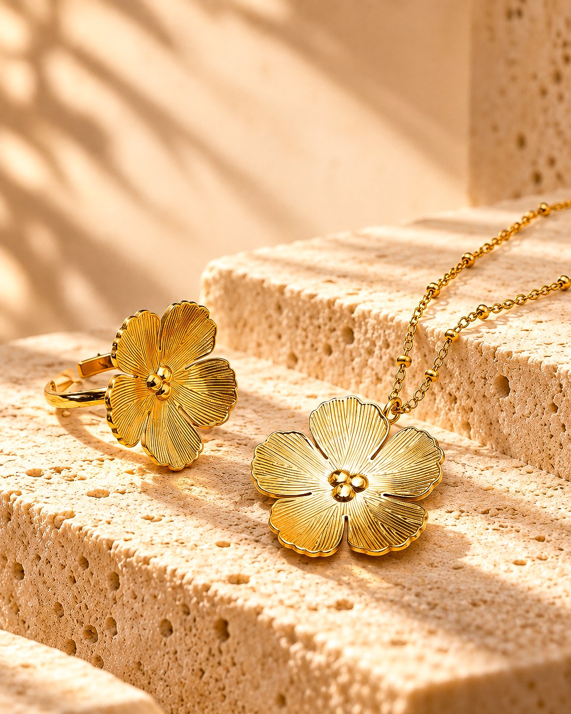 Fiore Aurelia Collection on marble background with floral necklace and matching ring