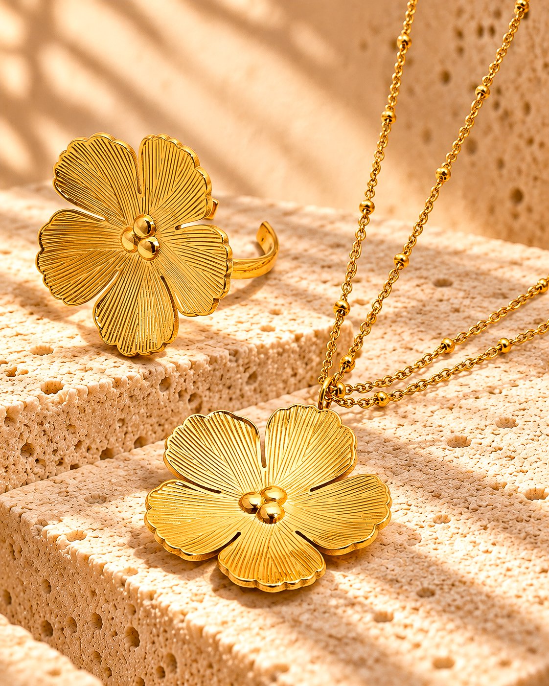 Fiore Aurelia Collection flat lay with floral necklace and matching ring