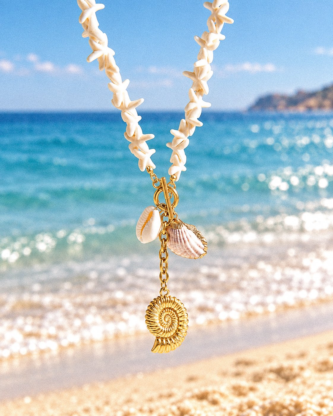 Marina Alba Necklace displayed on background showing full front view with shell beads and gold charms