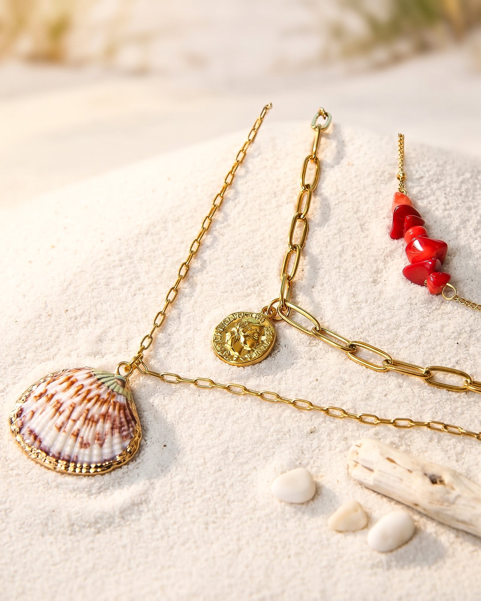 Seravelle Necklace displayed on an elegant background with layered gold chains and coastal-inspired details