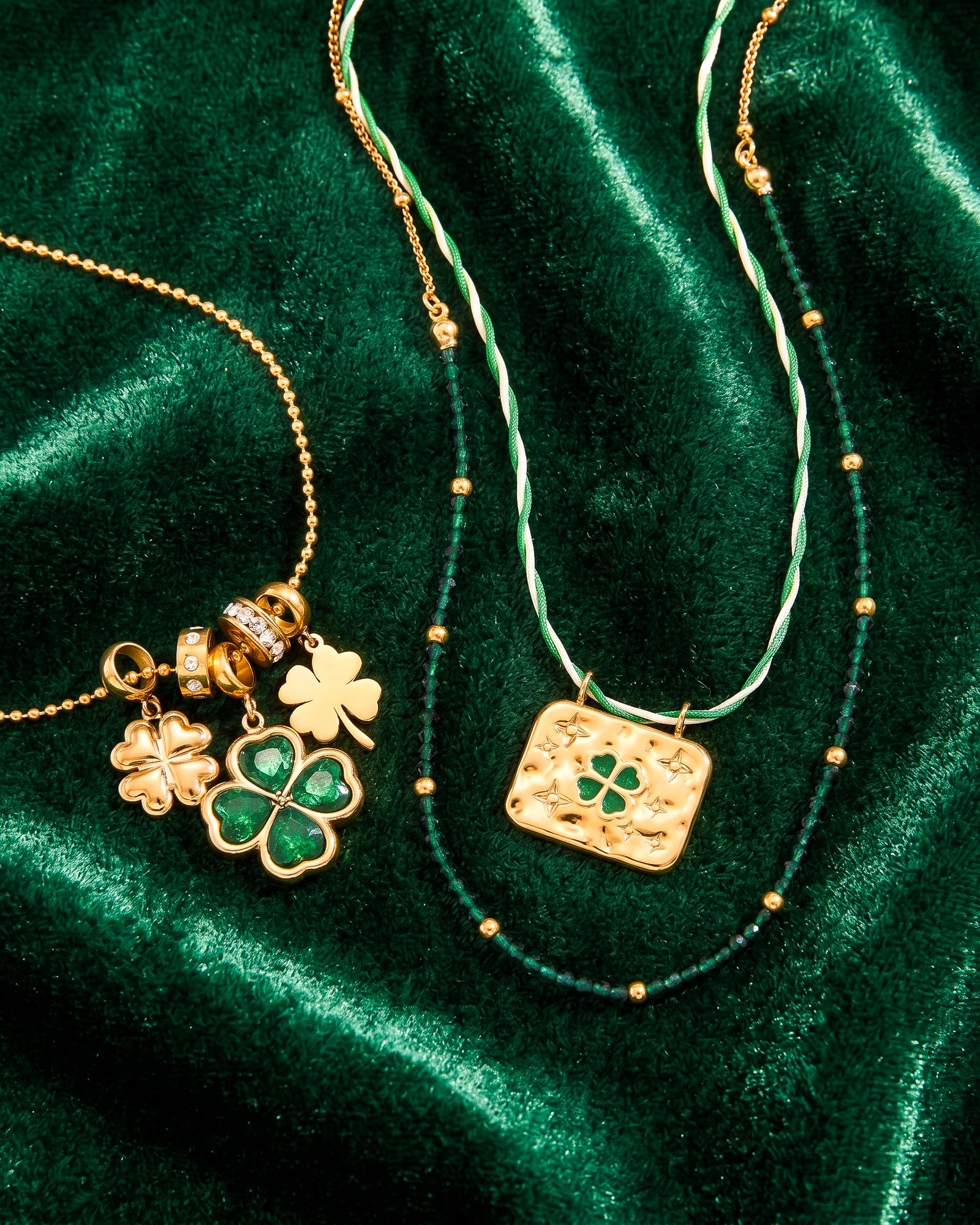 Close-up of Veralia Duo Necklace showing green crystal clover and polished golden charms