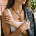 Ambralia Necklace side view on model with smoky bead necklace and gold accents