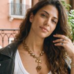 Close-up of Ambralia Necklace on model showing smoky heart beads and toggle detail