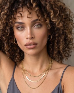 Elvara Necklace on model front view with elegant layered gold chains