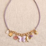 Lunella Charm Necklace displayed on a clean background showing full necklace design
