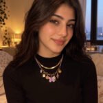 Lunella Charm Necklace worn by model with lilac braided cord and gold charm details
