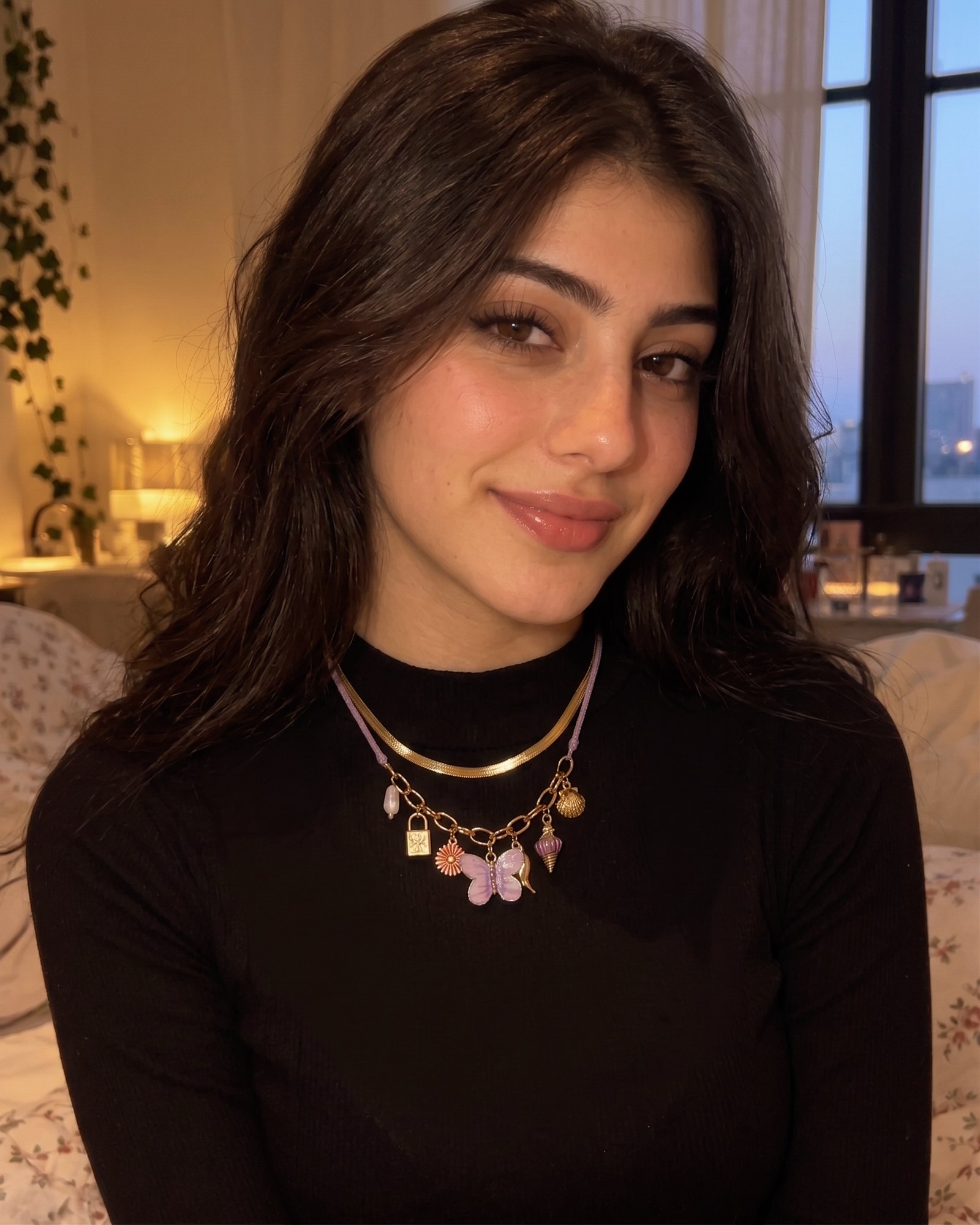 Lunella Charm Necklace worn by model with lilac braided cord and gold charm details