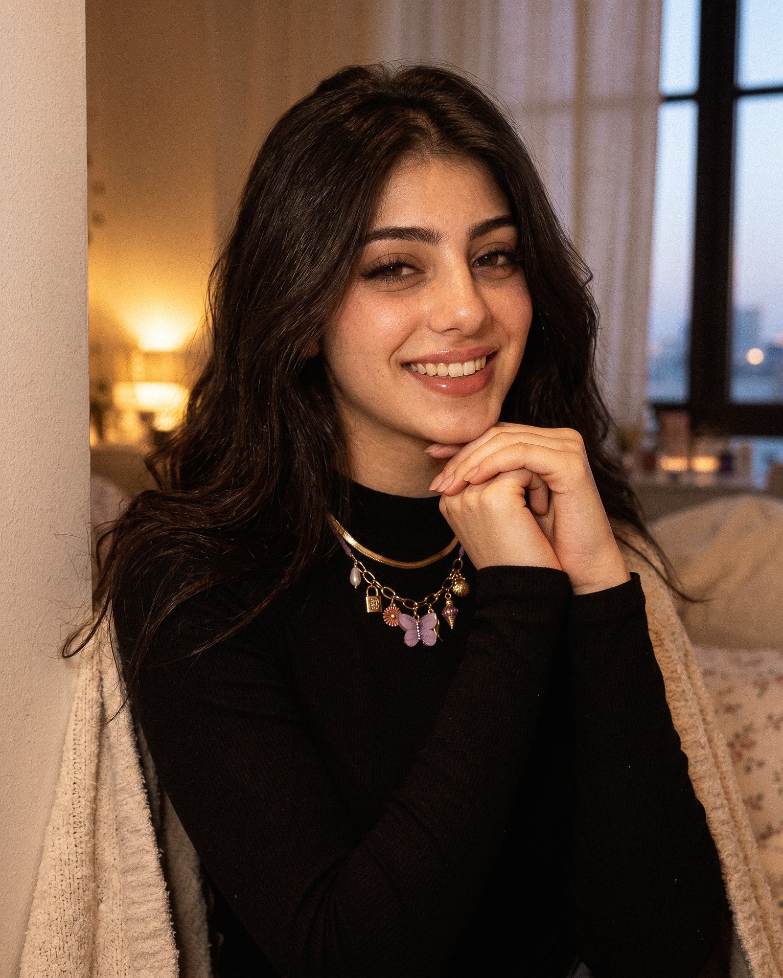 Elegant model portrait featuring Lunella Charm Necklace with colorful whimsical charms
